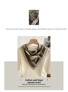 Close-up of green and brown geometric woven texture on a soft linen square scarf