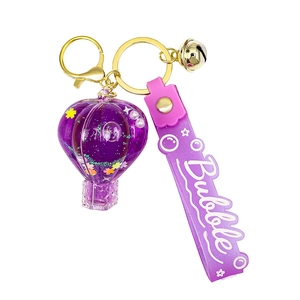 Purple hot air balloon liquid sand keychain with glitter sequins and silicone strap