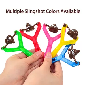 Close-up of colorful slingshot sets with funny emoji poop projectiles for stress relief