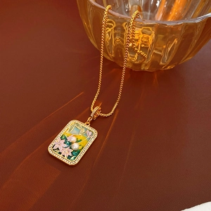 Detail of vintage enamel necklace with zircon flower pattern and freshwater pearls