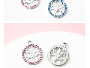 Macro detail of tree of life pendants with pink and blue crystal rhinestones