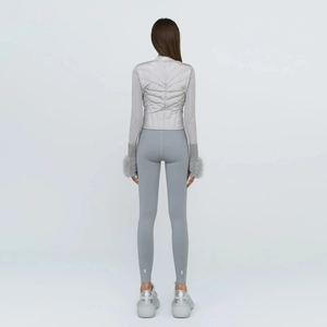 Rear view of grey high-waist thermal leggings with stylish silver cross patterns at ankles