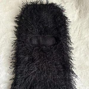 Detail of black balaclava showing soft feather yarn texture and eye hole opening