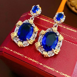 Vintage oval blue zircon earrings in two-tone silver and gold luxury metal finish