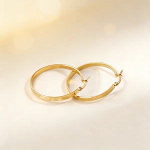 Classic minimalist gold stainless steel hoop earrings with polished metallic finish