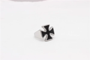 Macro detail of silver titanium steel ring featuring a black Iron Cross medal design