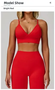 Close-up of red seamless yoga set with V-neck sports bra and high-waisted leggings