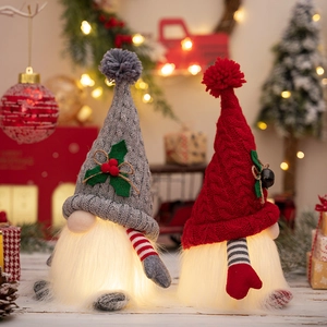 Lighted Christmas plush gnomes with knitted hats and holiday decorations on festive background