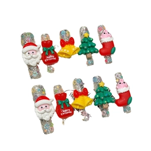 Luxury 3D Christmas nail charms with bells and Santa motifs on silver glitter base