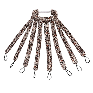 Leopard print heatless hair curler with eight rods and elastic headband on white background