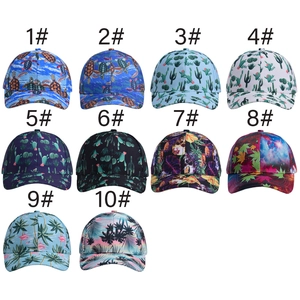 Grid view of baseball caps featuring cactus, turtle, and flamingo printed patterns