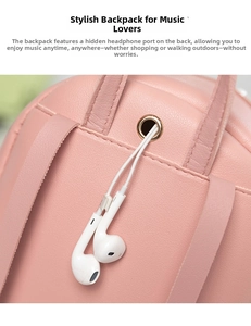 Detailed view of pink leather backpack featuring a built-in hidden metal earphone port