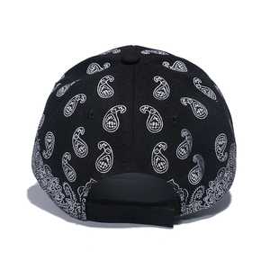 Rear view of black paisley print baseball cap with adjustable strap and cotton fabric
