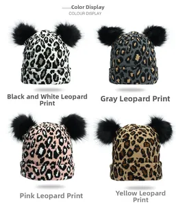 Detailed grid view showcasing four leopard print knit beanies with double faux fur pom poms