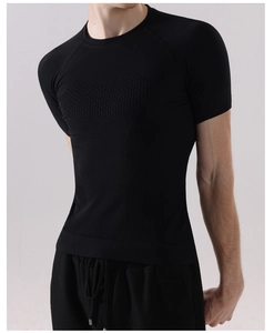 Detailed close-up of seamless breathable mesh and muscle compression texture on black gym shirt