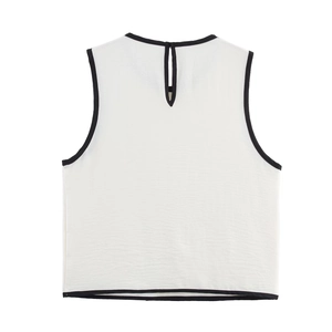 Women's white sleeveless crepe top with black contrast trim and teardrop back button
