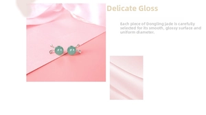 Detailed view of polished green aventurine rabbit earrings with 925 silver base
