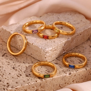 Detailed close-up of 18K gold plated rings with colorful rectangular zirconia gemstones