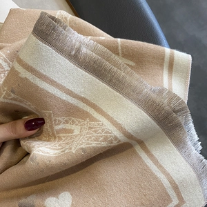 Faux cashmere shawl with Eiffel Tower patterns and fringe details in khaki and cream