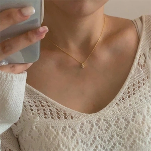 Minimalist 925 sterling silver gold teardrop necklace for women displayed on model