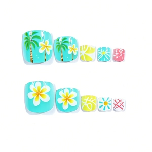 Detail view of tropical toe press-on nails with blue background, coconut trees and flowers