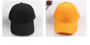 Side-by-side view showing basic black and yellow cotton baseball caps with curved brims