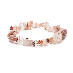 Detailed macro view of natural irregular red and white crystal gravel handmade bracelet