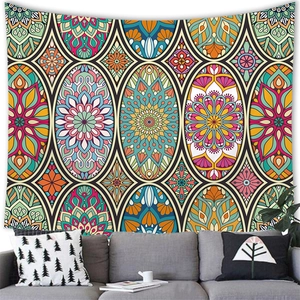 Detail of bohemian mandala tapestry featuring vibrant floral patterns over a sofa