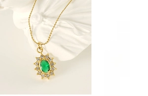 Detail of sunflower necklace with green emerald zircon and gold stainless steel chain