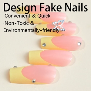 Pink and yellow French fake nails with decorative butterfly and rhinestones