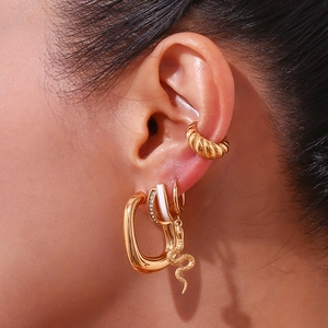Detail shot of 18K gold plated earring set with hammer texture and snake charms