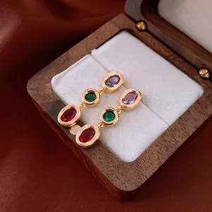 Vintage gold plated earrings with oval purple, green and red cubic zirconia gemstones