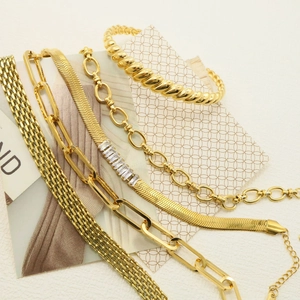 Set of gold-plated stainless steel bracelets including snake chain and bangle for women