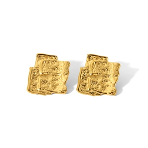 Detail of 18K gold plated earrings with abstract geometric crushed texture and vintage feel