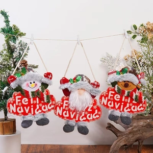 Three plush Christmas hanging ornaments with Santa, snowman and reindeer on wooden background