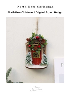 Detail view of a wooden Christmas red door ornament with pine needles and pinecones
