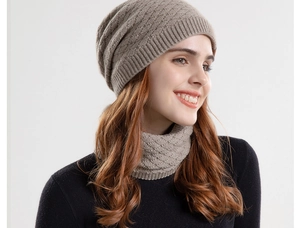 Close-up of winter knit beanie and neck warmer set in oatmeal beige with diamond texture