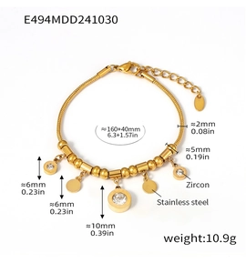 Detail of gold stainless steel bracelet with zircon charms and lobster clasp