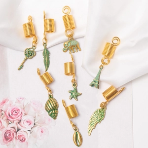 Golden spiral hair jewelry set with green enamel charms like Eiffel Tower and shell