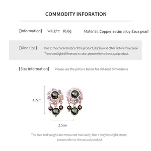 Detailed size chart showing 4.7cm floral pearl drop earrings with purple resin petals