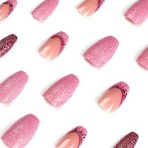Pink and purple glitter press-on nails with French tip design on white background