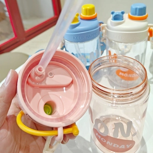 Detail of pink straw cup lid showing high-quality plastic and Monday keep happy print