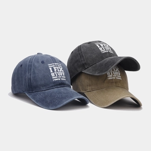 Washed cotton vintage baseball caps in blue, black, and khaki with humor print