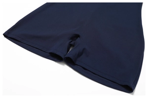 Detail shot of navy blue seamless yoga bodysuit showing high-quality stitching and fabric