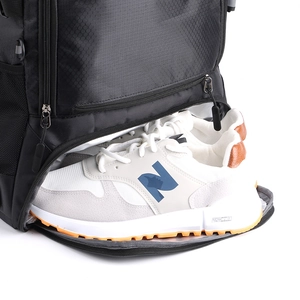 Waterproof sports backpack with a dedicated bottom compartment for athletic shoes
