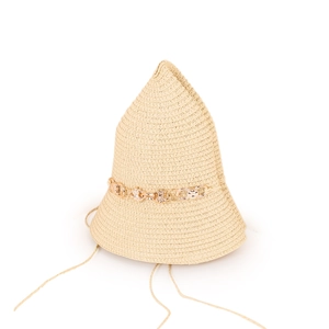 Detailed weave texture of straw sun hat with decorative golden flower metal chain