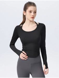 Detail view of black slim-fit yoga top with thumbholes and neck strap design