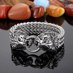 Macro shot of stainless steel lion head bracelet showing intricate relief texture details