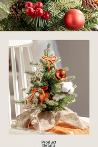 Macro detail of Nordic mini Christmas tree with wooden ornaments and warm orange bows