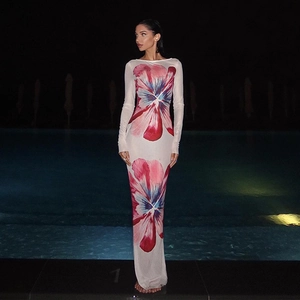Close-up of elegant floral print on white mesh bodycon maxi dress with long sleeves